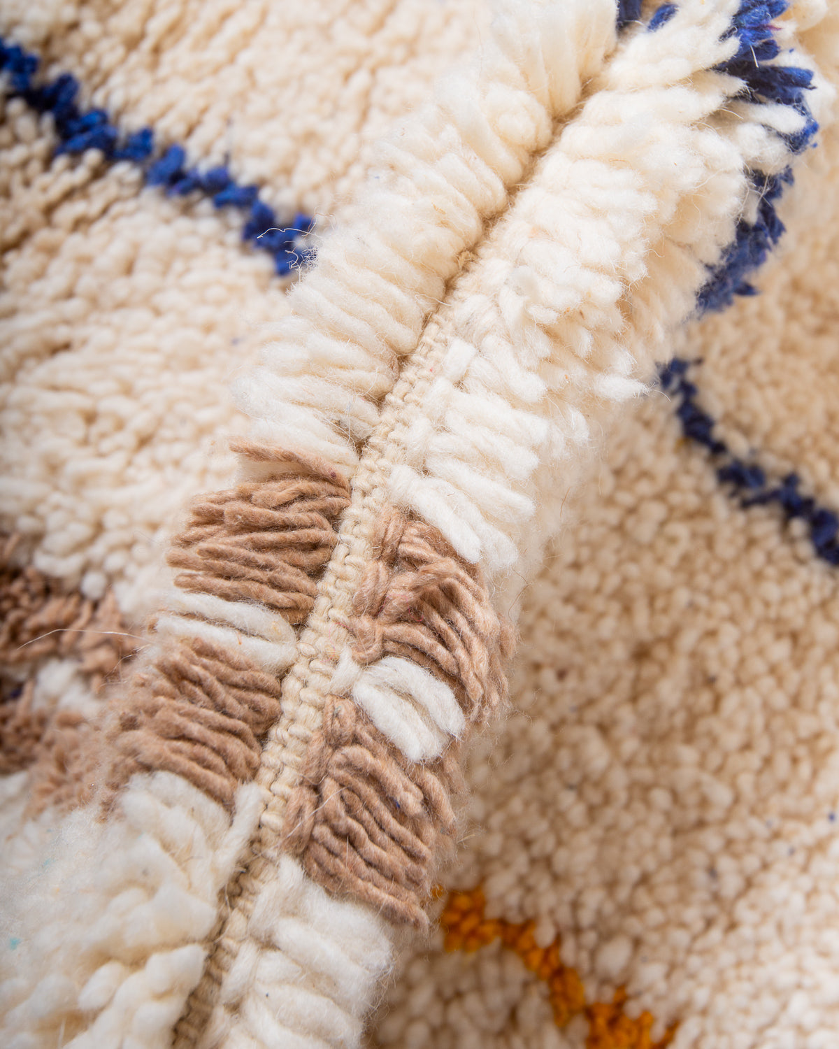Modern, designer, handcrafted Berber rug from Morocco. Beniourain carpet with beautiful colours and patterns and fluffy wool texture.